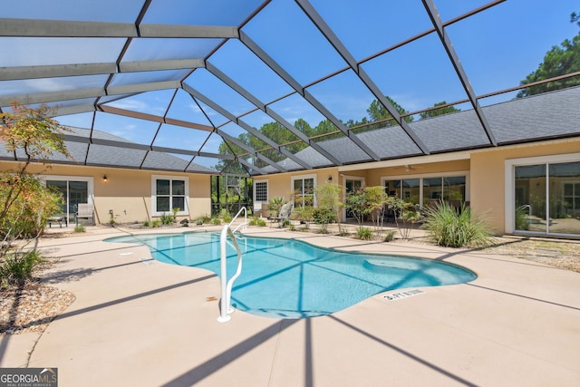 view of pool featuring a lanai and a patio area