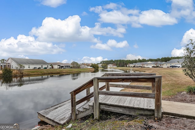 dock area with a water view