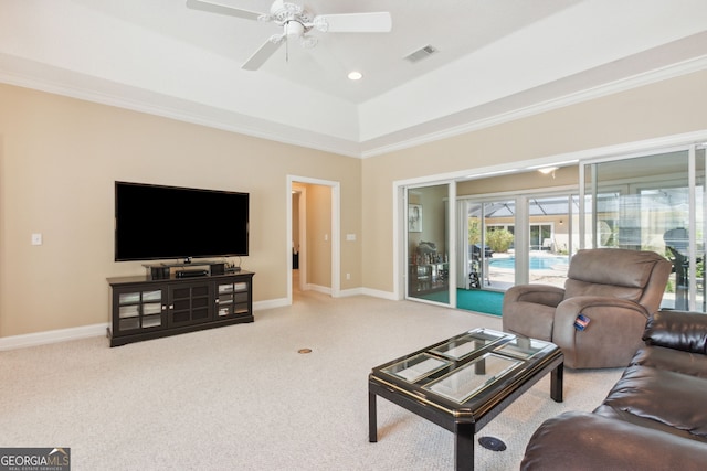 living room with light colored carpet, ceiling fan, and crown molding