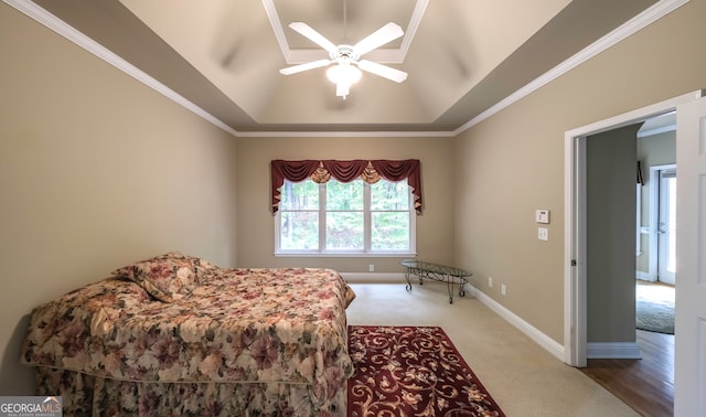 bedroom with carpet, ceiling fan, and ornamental molding