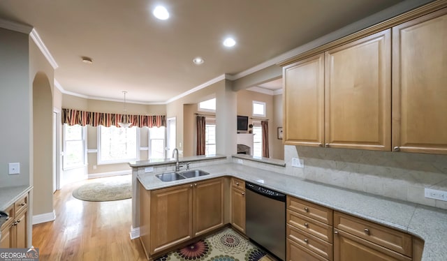 kitchen featuring kitchen peninsula, ornamental molding, sink, dishwasher, and light hardwood / wood-style floors