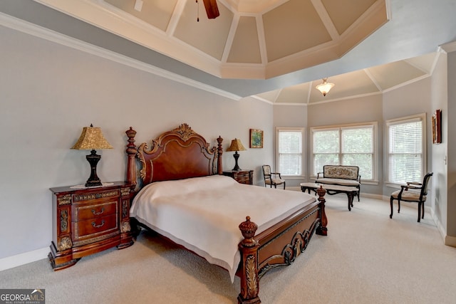 carpeted bedroom with ornamental molding, a high ceiling, and ceiling fan