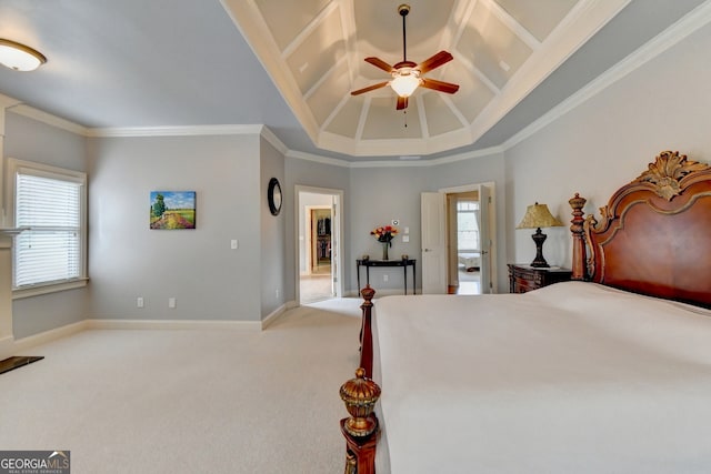 carpeted bedroom featuring ceiling fan and crown molding