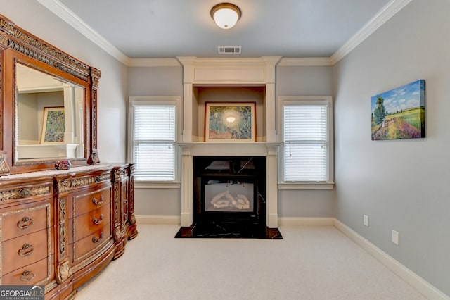 sitting room featuring light carpet and crown molding