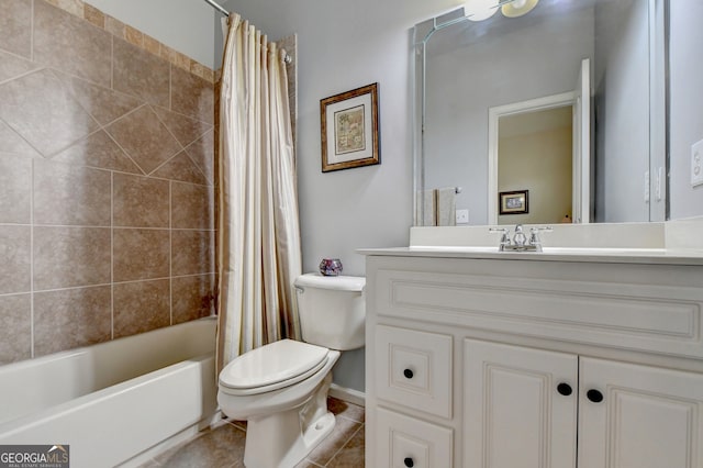 full bathroom featuring tile patterned floors, vanity, shower / bath combination with curtain, and toilet