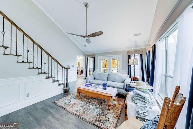 living room featuring ceiling fan, french doors, vaulted ceiling, and hardwood / wood-style flooring