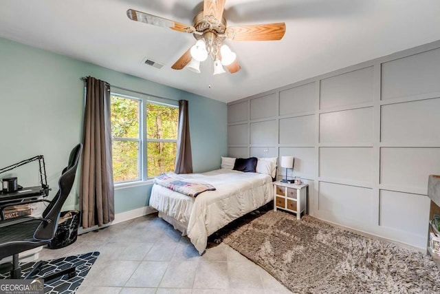 tiled bedroom with ceiling fan