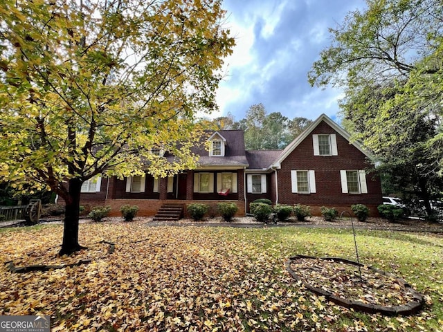 view of front of home with a front yard