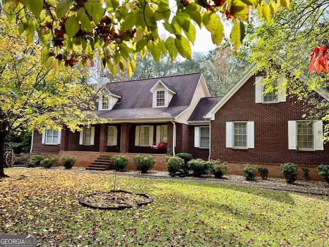 new england style home with a front lawn