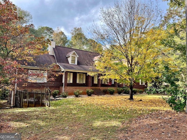 view of side of home featuring a yard