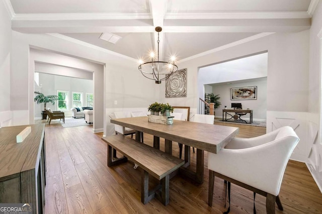 dining space with beam ceiling, an inviting chandelier, wood-type flooring, crown molding, and coffered ceiling