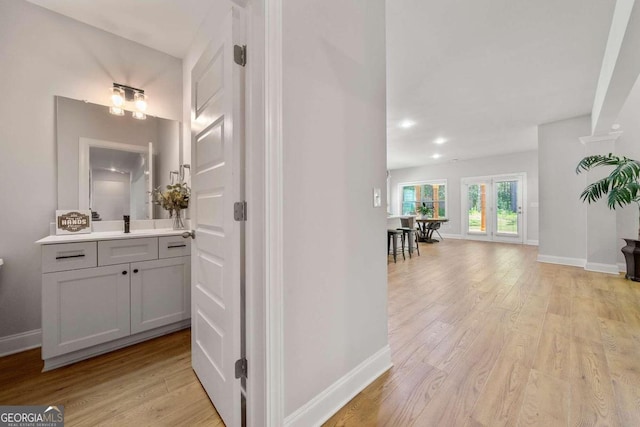 hall with light hardwood / wood-style flooring