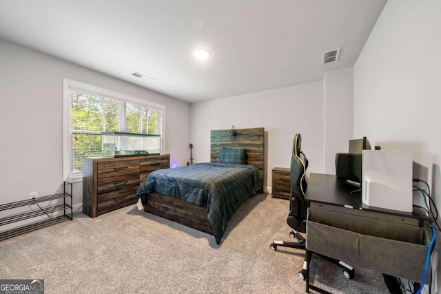 carpeted bedroom featuring a baseboard heating unit