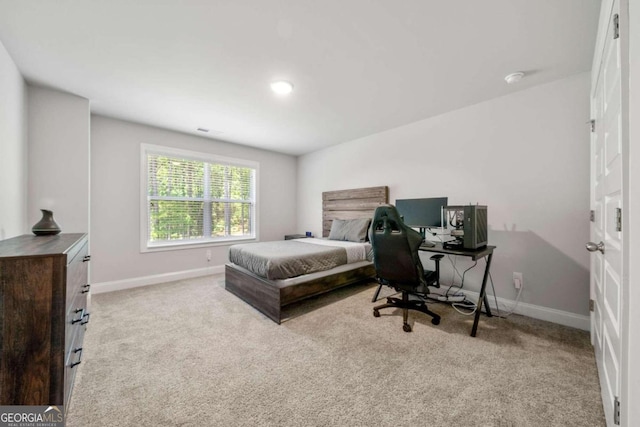 bedroom featuring light colored carpet