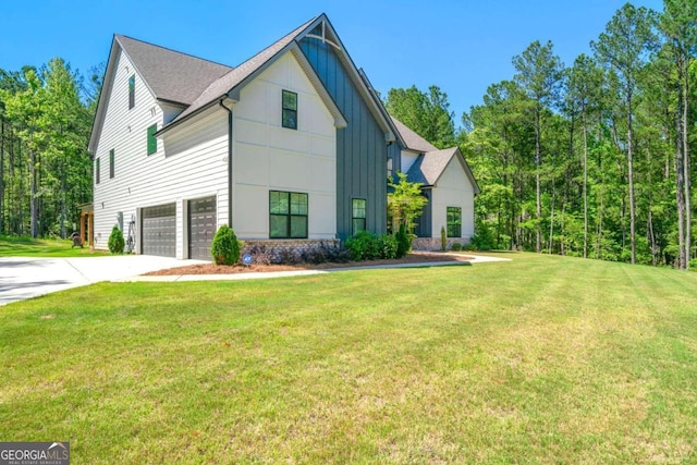 view of front of property with a front lawn and a garage