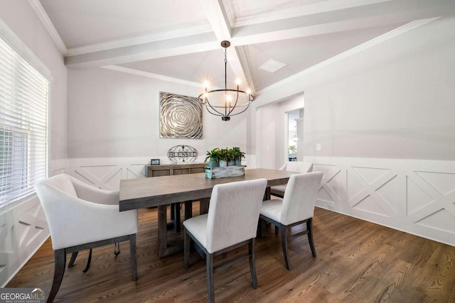 dining area with dark wood-type flooring, an inviting chandelier, ornamental molding, and beam ceiling