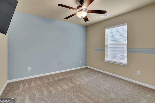 carpeted empty room with ceiling fan