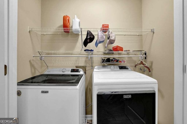 laundry room with separate washer and dryer