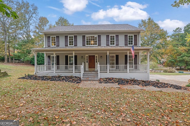 view of front of property featuring a porch and a front lawn