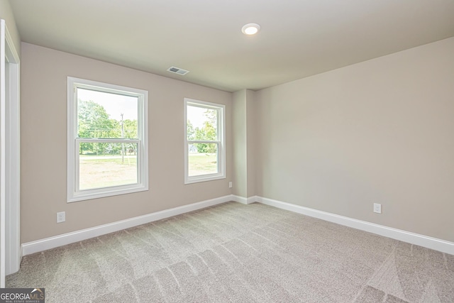 unfurnished room featuring carpet