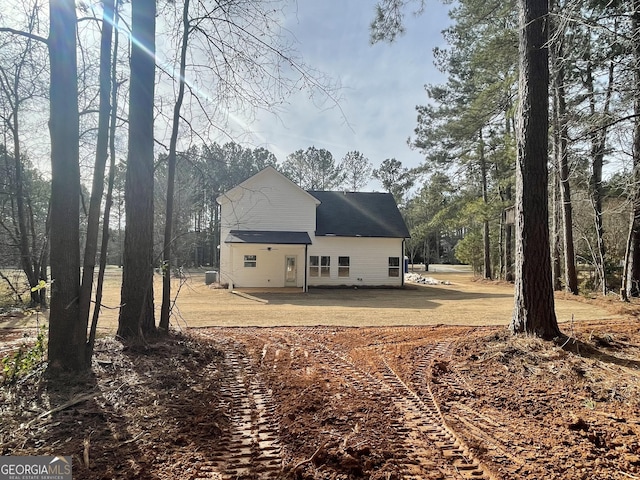 view of side of property featuring a patio area