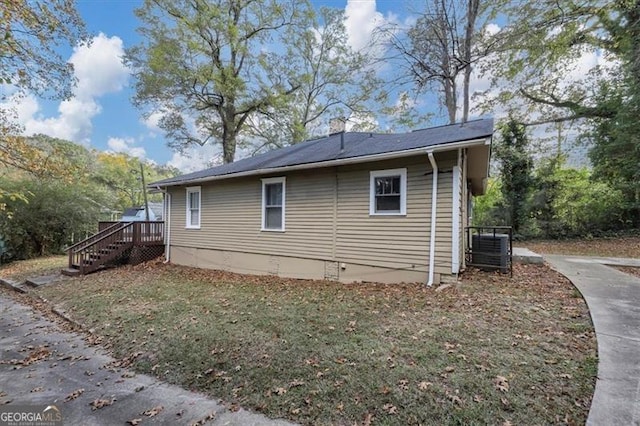 view of side of property with central AC unit