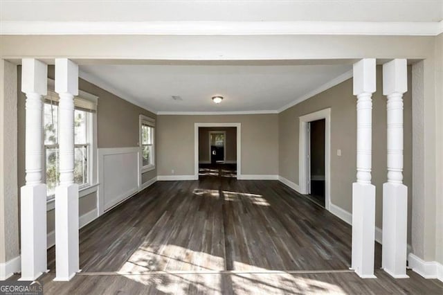 interior space with ornamental molding and dark wood-type flooring