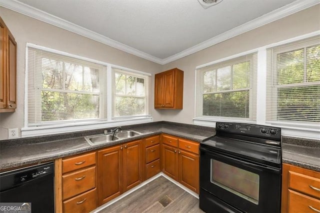 kitchen with crown molding, sink, black appliances, and dark hardwood / wood-style flooring