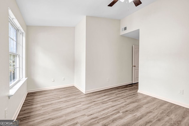 unfurnished room featuring light hardwood / wood-style flooring and ceiling fan