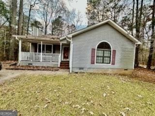 ranch-style house featuring a front yard and a porch