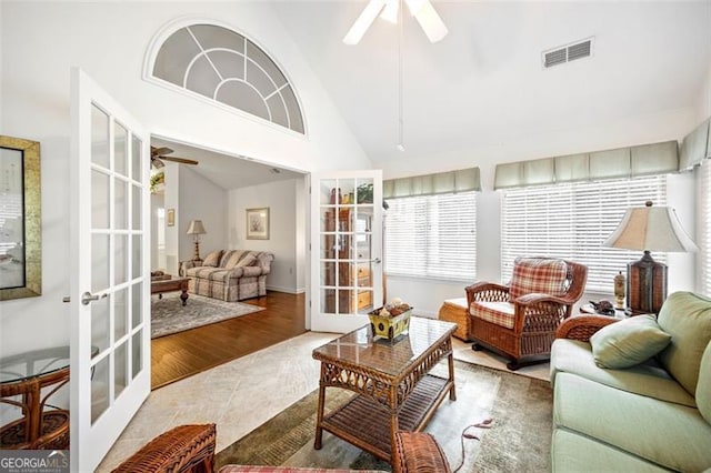 sunroom / solarium with french doors, ceiling fan, and lofted ceiling