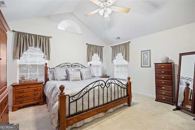 carpeted bedroom with ceiling fan and lofted ceiling