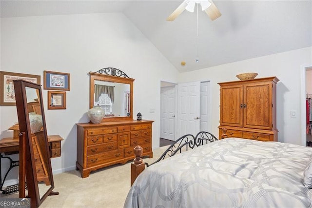 carpeted bedroom featuring high vaulted ceiling and ceiling fan