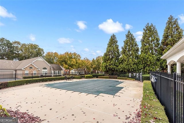 view of swimming pool featuring a patio area