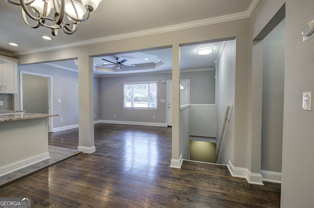 1204 Westridge Rd SW, Atlanta, GA 30311 - unfurnished dining area with dark wood-style flooring, a chandelier, crown molding, ceiling fan, and baseboards