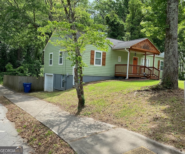 1204 Westridge Rd SW, Atlanta, GA 30311 - view of front of house with a porch, a shingled roof, a garage, and driveway