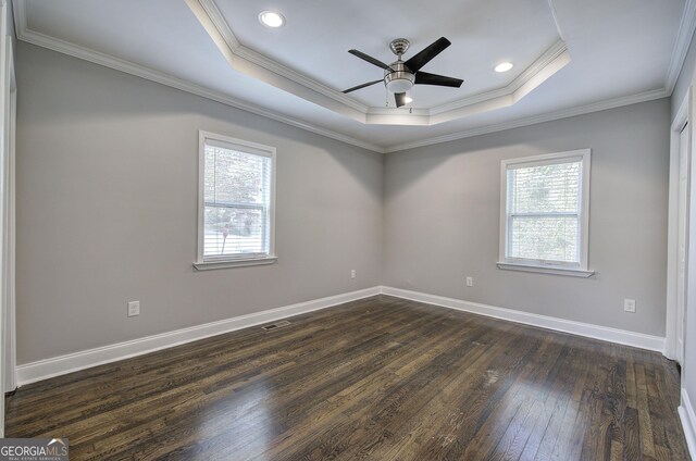 1204 Westridge Rd SW, Atlanta, GA 30311 - unfurnished room featuring a raised ceiling, dark wood-style flooring, ornamental molding, ceiling fan, and baseboards