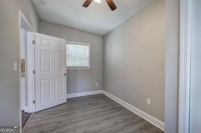 spare room featuring ceiling fan and hardwood / wood-style flooring