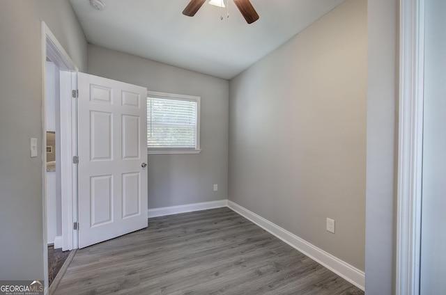 1204 Westridge Rd SW, Atlanta, GA 30311 - spare room featuring a ceiling fan, wood finished floors, and baseboards