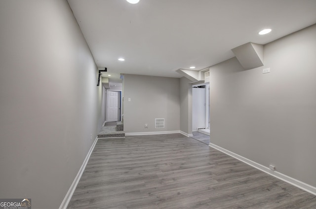 basement featuring light wood-type flooring