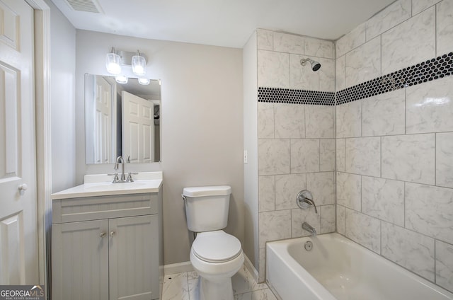 full bathroom featuring toilet, vanity, and tiled shower / bath