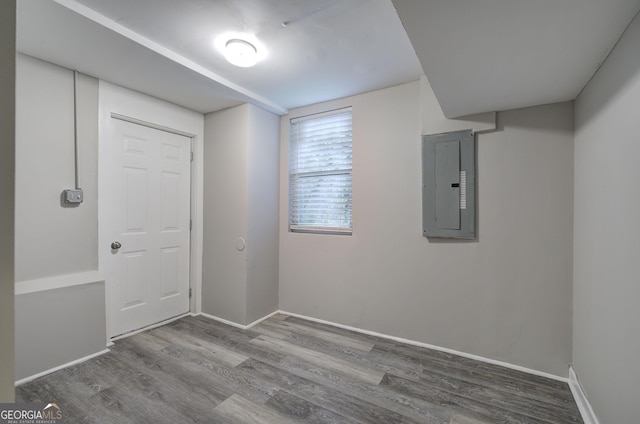 interior space with wood-type flooring and electric panel