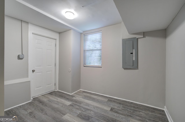 1204 Westridge Rd SW, Atlanta, GA 30311 - spare room featuring electric panel, wood finished floors, and baseboards