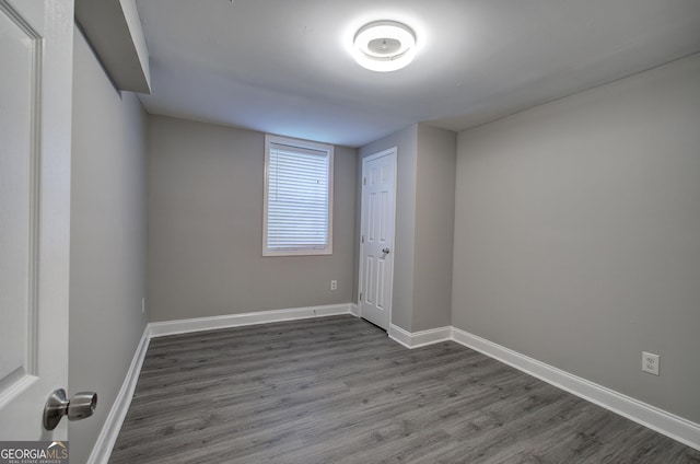 empty room featuring dark hardwood / wood-style flooring