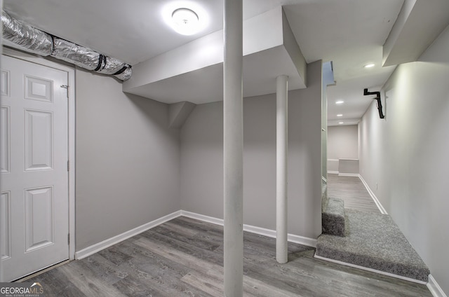 basement with wood-type flooring