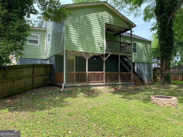 1204 Westridge Rd SW, Atlanta, GA 30311 - back of property with a fire pit, a ceiling fan, stairs, and a wooden deck