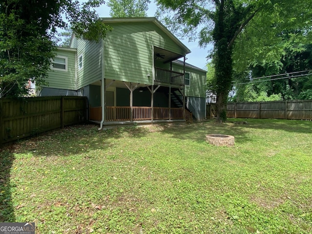 1204 Westridge Rd SW, Atlanta, GA 30311 - rear view of house with a fire pit, ceiling fan, stairs, and a wooden deck