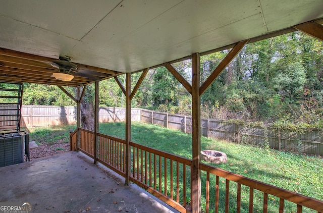 view of patio with ceiling fan and an outdoor fire pit