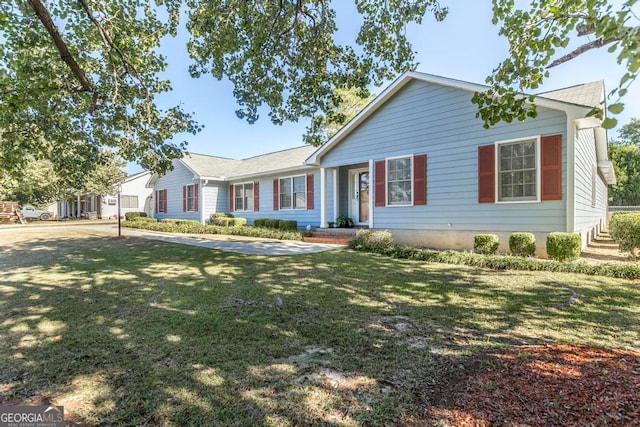 single story home featuring a front lawn