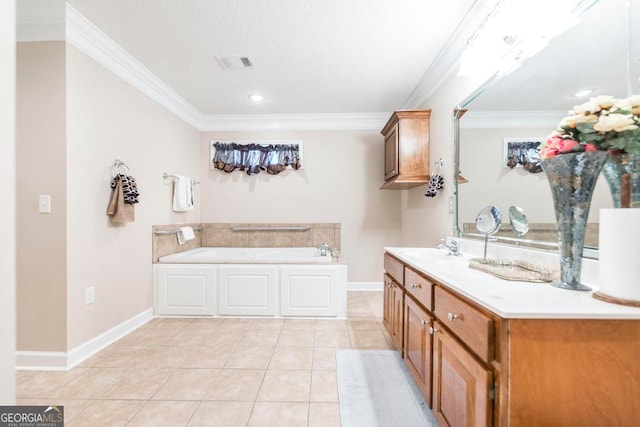 bathroom with ornamental molding, tile patterned flooring, a bathtub, and vanity